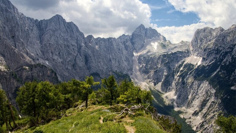 Dramatic rock walls of the Julian Alps seen from the Slemenova Spica trail