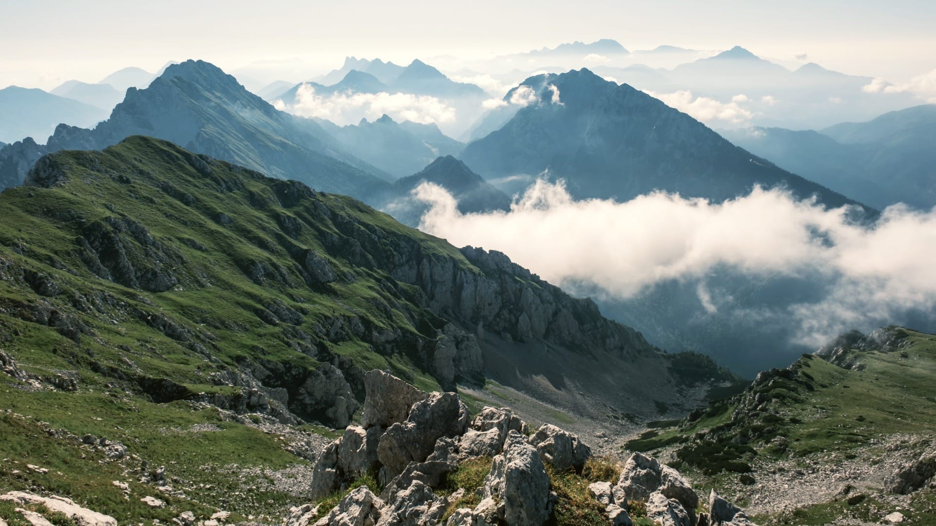 Cloud sea filling the valley below the steeper, rockier western descent route from Stol